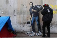 Banksy migrants Steve Jobs