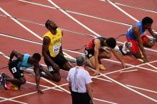 Le Jamaïcan Usain Bolt se prépare pour le départ d'une série du 100 m aux Championnat du monde d'ath