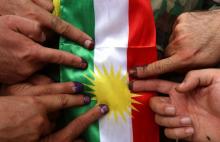 Des affiches encourageants les citoyens à voter au référendum sur l'indépendance du Kurdistan, collé