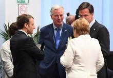 Le président Emmanuel Macron, le négociateur du Brexit Michel Barnier, la chancelière allemande Ange
