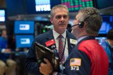 Traders sur le parquet du New York Stock Exchange le 18 octobre 2017 à New York