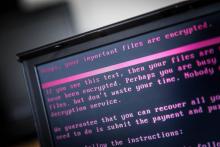 Un ordinateur portable affiche un message après avoir été infecté par un ransomware dans le cadre d'