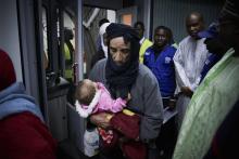 Des migrants maliens rapatriés de Libye par l'OIM arrivent à Bamako le 13 décembre 2017