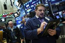 Traders sur le parquet du New York Stock Exchange le 13 décembre 2017