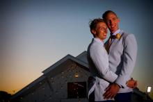 Australian athletes Craig Burns (L) and Luke Sullivan (R) kiss after their marriage ceremony at Summergrove Estate, New South Wales on January 9, 2018