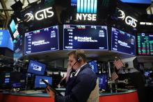 Trader sur le parquet du New York Stock Exchange le 17 janvier 2018 à New York