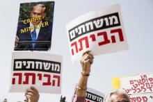Manifestation contre le Premier ministre israélien Benjamin Netanyahu près les conclusions de la police recommandant son inculpation pour corruption, le 16 février 2018 à Tel Aviv