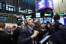 Traders sur le parquet du New York Stock Exchange le 9 février 2018