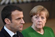 Le Président français Emmanuel Macron (G) et la chancelière allemande Angela Merkelà Bruxelles le 23 février 2018