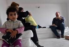Une famille de migrants consulte un médecin de MSF, à Sarajevo le 24 mars 2018