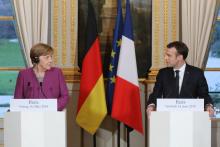 Le président Emmanuel Macron et la Chancelière allemande Angela Merkel lors d'une conférence de presse, le 16 mars 2018 à l'Elysée, à Paris