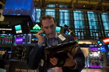 Traders sur le parquet du New York Stock Exchange 15 mars 2018 à New York