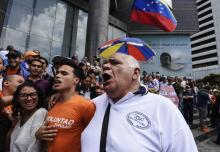 Opositores venezolanos protestan frente a la sede de Naciones Unidas en Caracas, el 12 de marzo de 2018