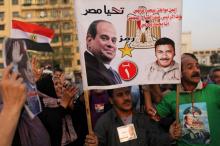 Des partisans du président égyptien Abdel Fattah al-Sissi célèbrent sa réélection sur la place Tahrir, au Caire, le 2 avril 2018