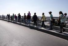 Des migrants centre-américains de la caravane Viacrucis Migrante à Tijuana, ville frontière avec les Etats-Unis, le 28 avril 2018