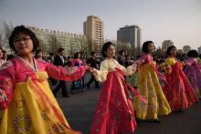 Students participate in the 'mass dance' event outside the Pyongyang Indoor Stadium