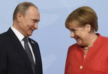 Le président russe Vladimir Poutine et la chancelière allemande Angela Merkel, lors du G20, le 7 jui