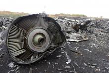 Un fragment de l'avion du vol MH17 à Grabové, dans l'Est séparatiste prorusse de l'Ukraine, le 9 septembre 2018