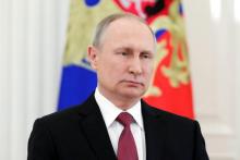 Russian President Vladimir Putin delivers a televised address to the nation in Moscow on March 23, 2018, following the announcement of the presidential election official results.