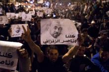 Des manifestants brandissent des portraits de Nasser Zafzafi, meneur du mouvement du "Hirak", le 30 mai 2017 à Al Hoceima, au Maroc