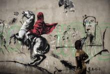 Oeuvre de Banksy, artiste de "Street art", réalisée dans une rue de Paris le 25 juin 2018