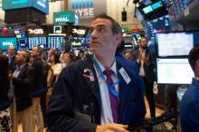 Traders sur le parquet du New York Stock Exchange le 19 juin 2018