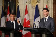Le président de la République français Emmanuel Macron (g) et le Premier ministre canadien Justin Trudeau (d) lors d'une conférence de presse commune au Parlement canadien à Ottawa, le 7 juin 2018