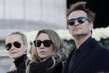 (g-d) Laeticia Hallyday, la femme de Johnny Hallyday, sa fille Laura Smet et son fils David Hallyday aux funérailles du chanteur à La Madeleine, le 9 décembre 2017 à Paris