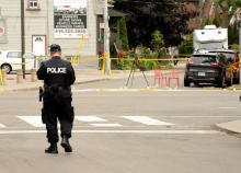 La police inspecte les lieux de la fusillade à Toronto, le 23 juillet 2018