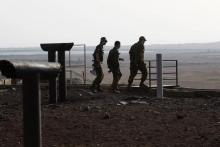 Des soldats israéliens dans le sud de la partie du plateau du Golan occupée et annexée par Israël, près de la province syrienne de Deraa, le 24 juillet 2018