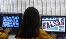 Des élèves de Unified Educational Centers (CEU) suivent un cours sur le "fake news: accès sécurité et véracité de l'information" à Sao Paulo le 21 juin 2018