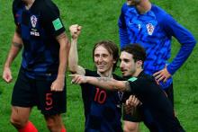 Les Croates Luka Modric (g) et Sime Vrsaljko exultent ils sont en finale du Mondial, le 11 juillet 2018 à Moscou
