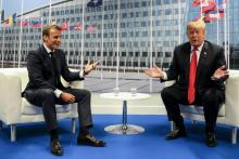 Le président français Emmanuel Macron et le président américain Donald Trump lors du sommet de l'OTAN, à Bruxelles, le 11 juillet 2018