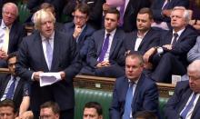 Capture d'une vidéo montrant l'ex-ministre des Affaires étrangères britannique Boris Johnson, s'exprimant devant la Chambre des communes le 18 juillet 2018.