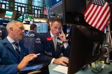 Traders sur le parquet du New York Stock Exchange le 22 août 2018