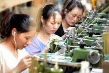 Dans une usine textile à Shangqiu, en Chine, le 13 août 2018