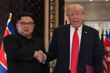 Le dirigeant nord-coréen Kim Jong Un et le président américain Donald Trump lors de leur sommet historique de Singapour le 12 juin 2018