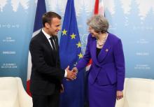 Emmanuel Macron et la Première ministre britannique Theresa May, lors de la réunion du G7 au Québec, le 8 juin 2018