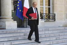 Le ministre des Affaires étrangères Jean-Yves Le Drianquitte l'Elysée, le 3 août 2018 à Paris