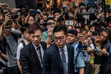 L'indépendantiste hongkongais Wayne Chan arrêté par la police lors d'un rassemblement devant le Club des correspondants étrangers (FCC) de Hong Kong, le 14 août 2018