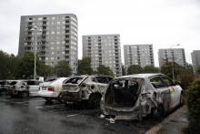 Des voitures brûlées à Göteborg, dans l'ouest de la Suède, le 14 août 2018