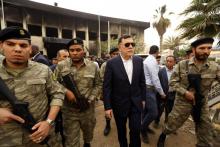 Fayez al-Sarraj, le Premier ministre du gouvernement d'union (GNA) reconnu par la communauté internationale, entouré de forces de sécurité, le 2 mai 2018 à Tripoli
