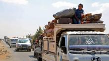 Des civils syriens fuient la province d'Idleb, après des bombardements du régime et de son allié russe le 6 septembre 2018