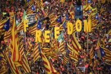 Des participants vêtus d'uniformes militaires d'époque prennent part à une reconstitution historique à Barcelone le 11 septembre 2018 pour la "Diada", "fête nationale" catalane commémorant la prise de