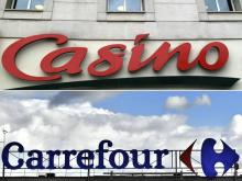 (COMBO) This combination of pictures created on September 24, 2018 shows the logo of French multinational group Casino (up) taken on July 28, 2010, and the logo of French retail giant Carrefour taken 
