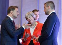 Les Premiers ministres luxembourgeois Xavier Bettel, britannique Theresa May et slovaque Peter Pellegrini lors du sommet de l'UE à Salzbourg, le 20 septembre 2018