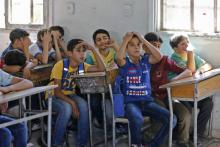 Photo d'élèves dans une école de Kafr Batna, dans la Ghouta orientale en Syrie, le 5 septembre 2018.