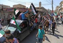 Manifestation contre le régime syrien de Bachar al-Assad, dans la partie de la province d'Idleb aux mains des insurgés, le 21 septembre 2018