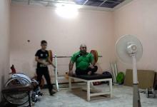 L'haltérophile iraqien Thaer al-Ali s'entraîne à Mossoul, en vue des pour les Jeux de Tokyo-2020, le 25 août 2018