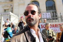Le militant et agriculteur Cédric Herrou arrive au tribunal de Nice pour son procès, le 22 octobre 2018